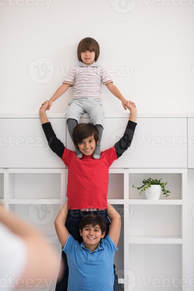 young boys posing line up piggyback photo