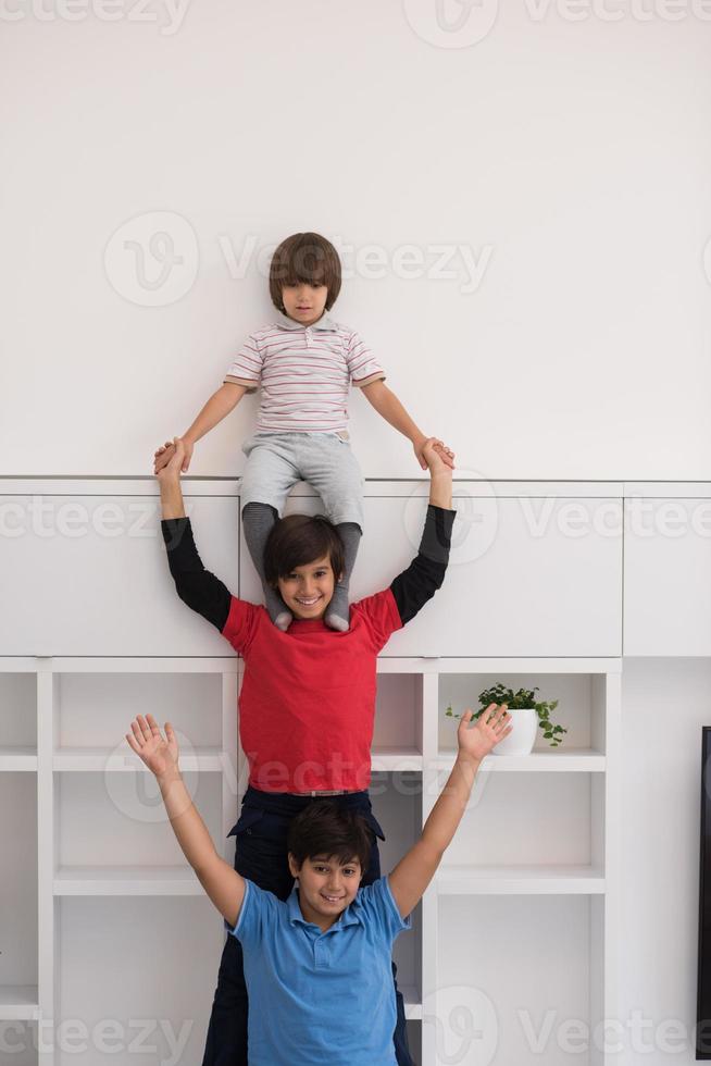 young boys posing line up piggyback photo