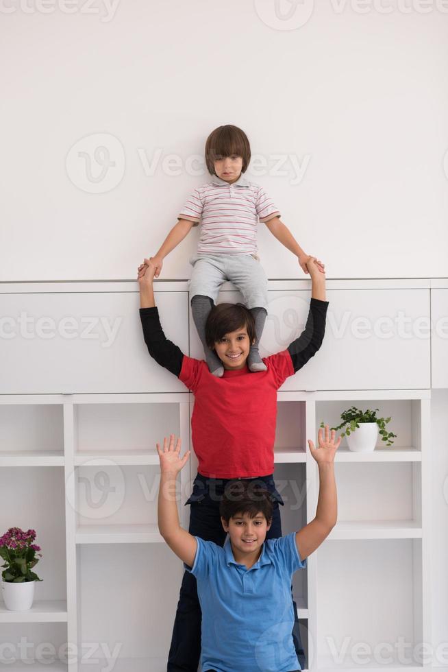 young boys posing line up piggyback photo