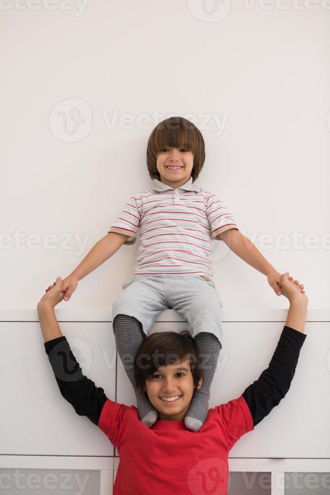 young boys posing line up piggyback photo
