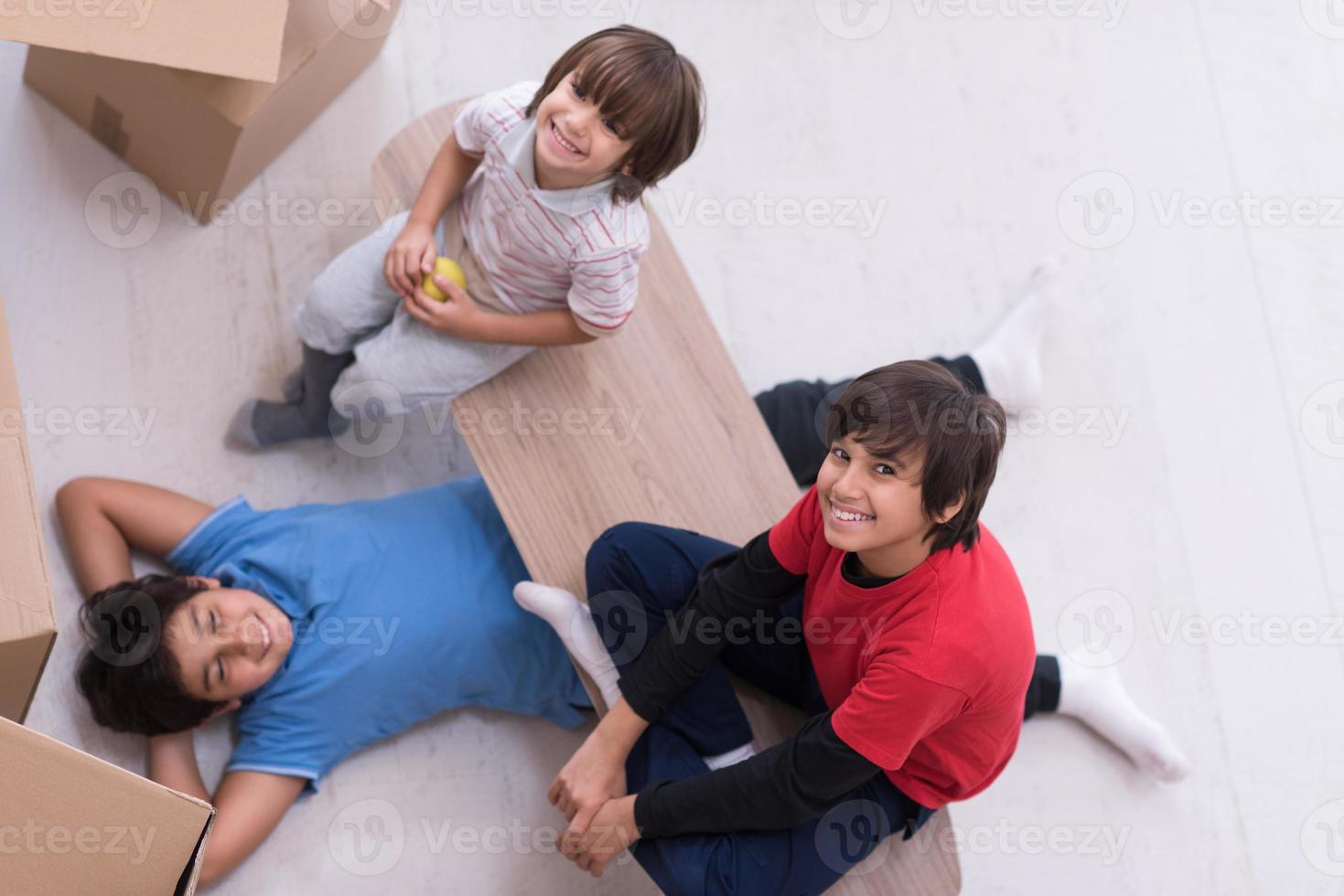 boys with cardboard boxes around them top view photo