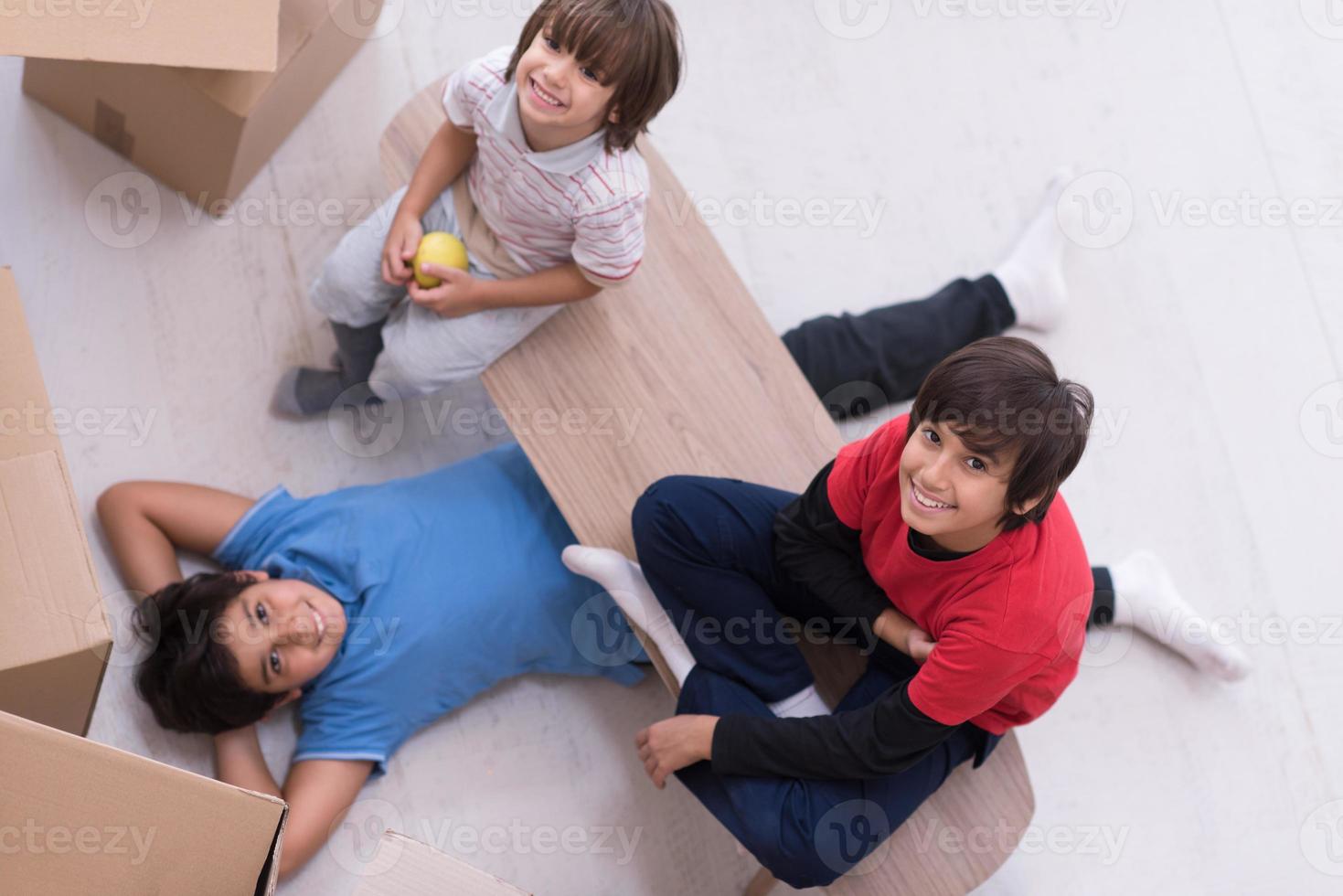 boys with cardboard boxes around them top view photo