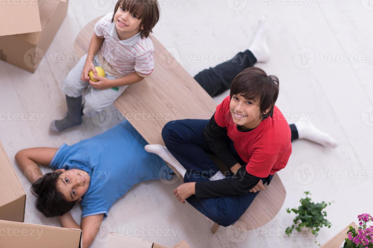boys with cardboard boxes around them top view photo