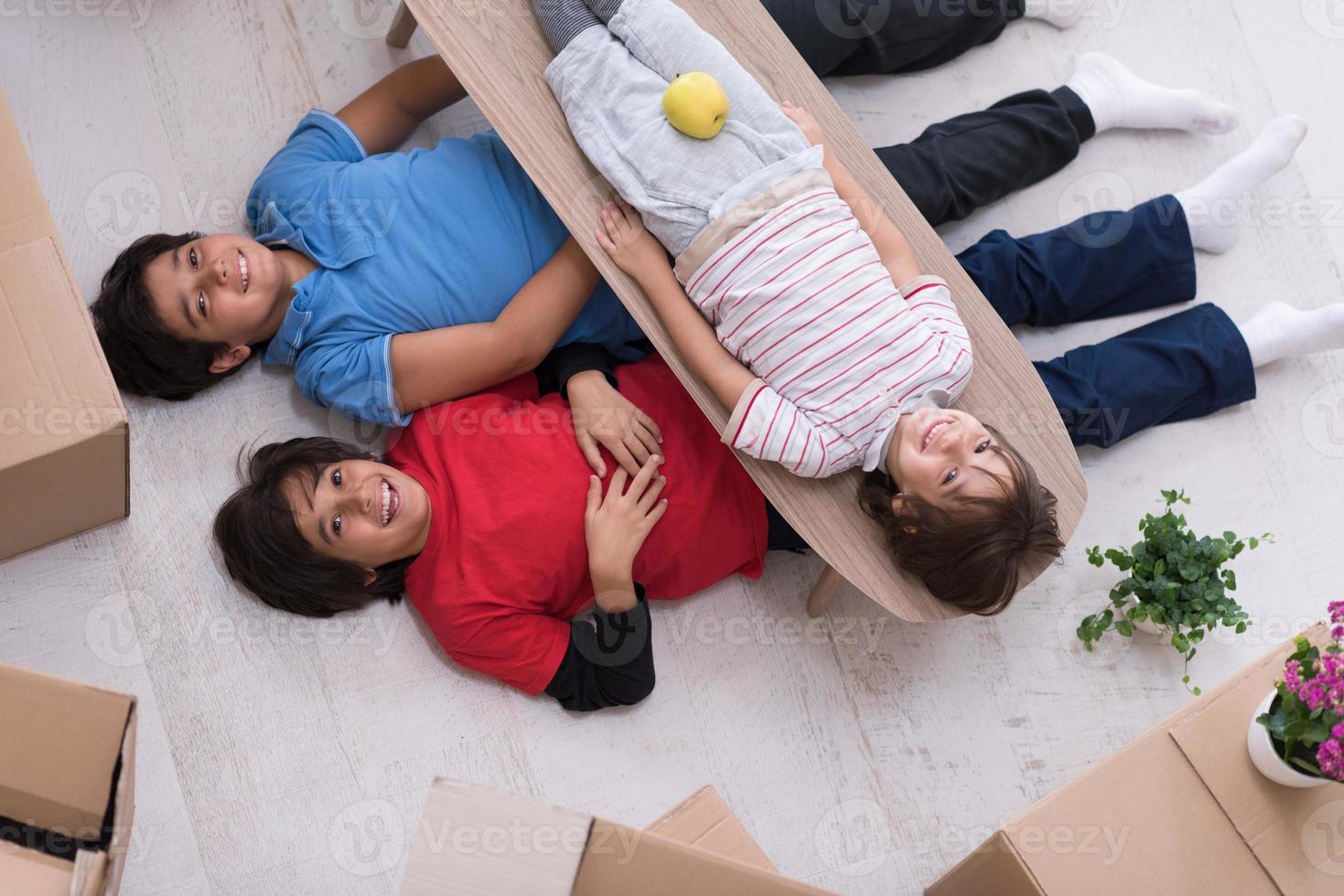 boys with cardboard boxes around them top view photo