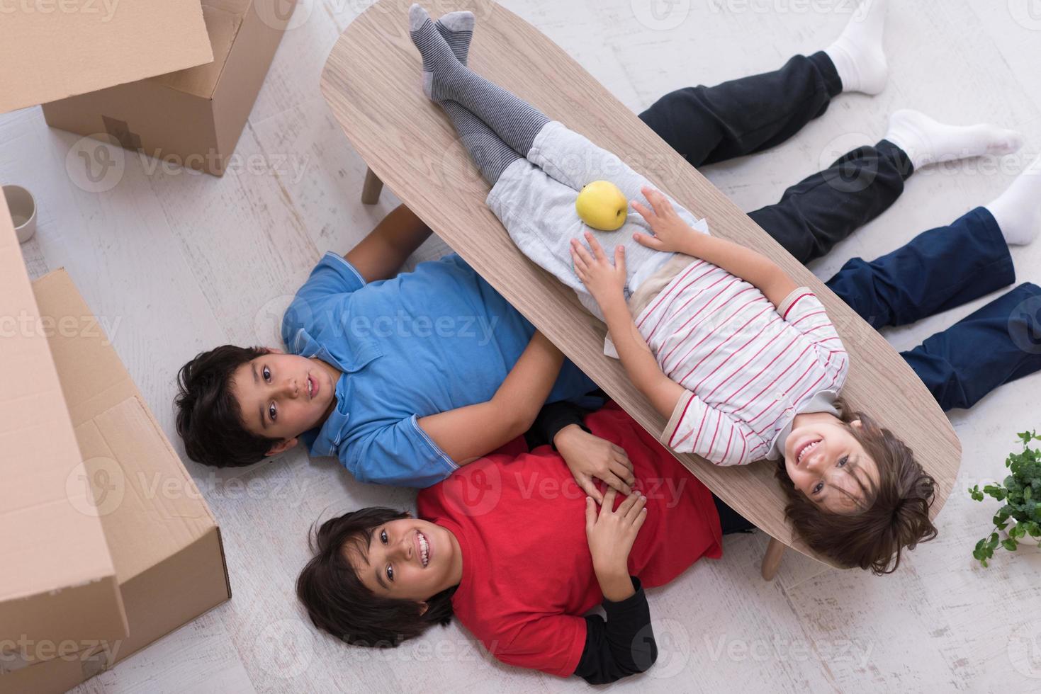 boys with cardboard boxes around them top view photo
