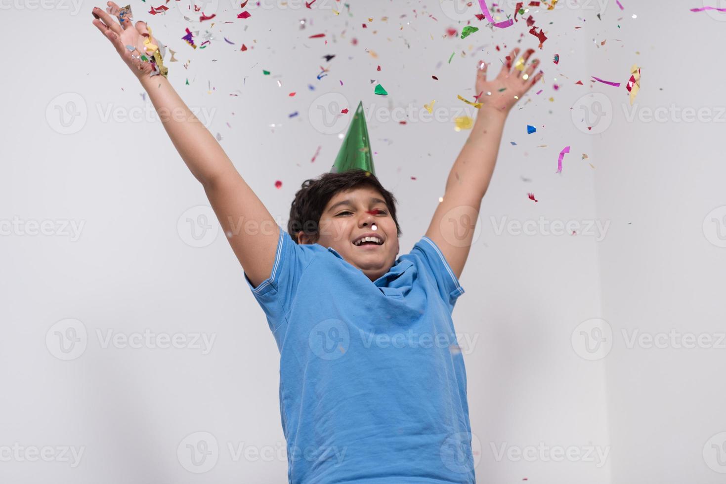 kid blowing confetti photo