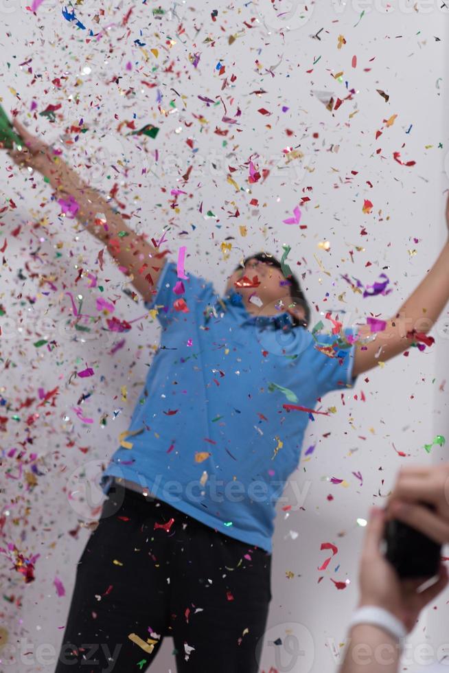 kid blowing confetti photo