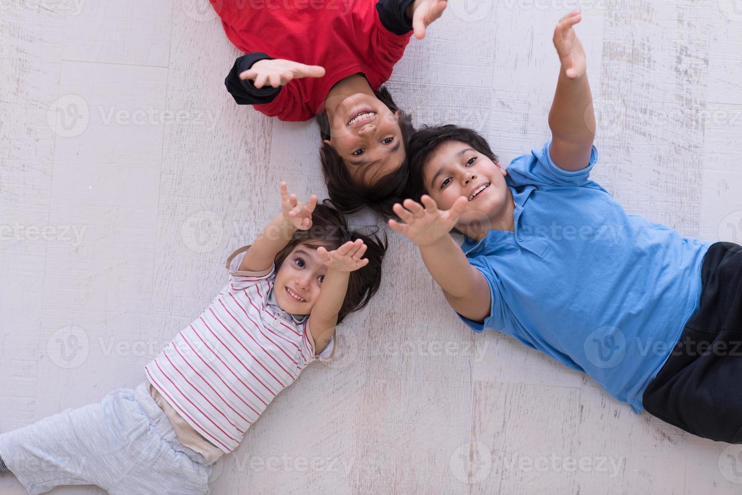 young boys having fun on the floor photo