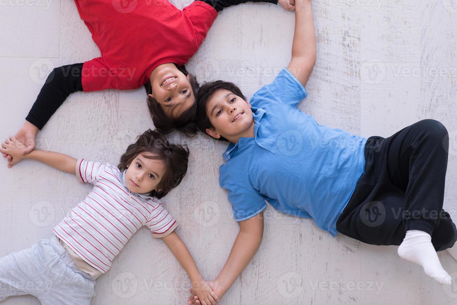 young boys having fun on the floor photo