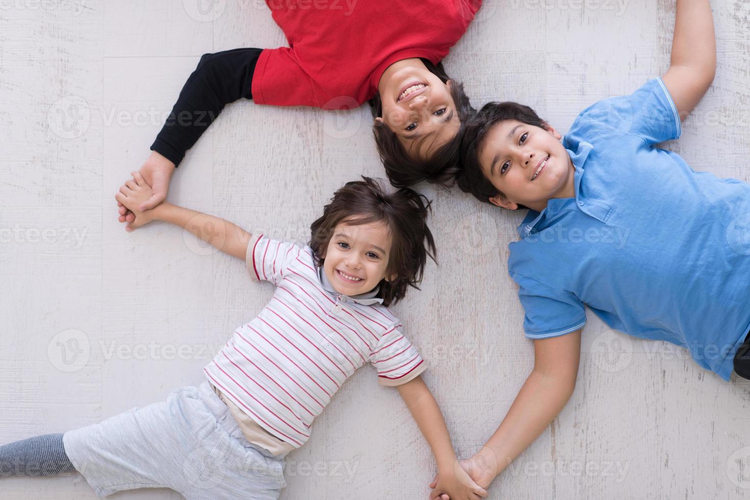 young boys having fun on the floor photo