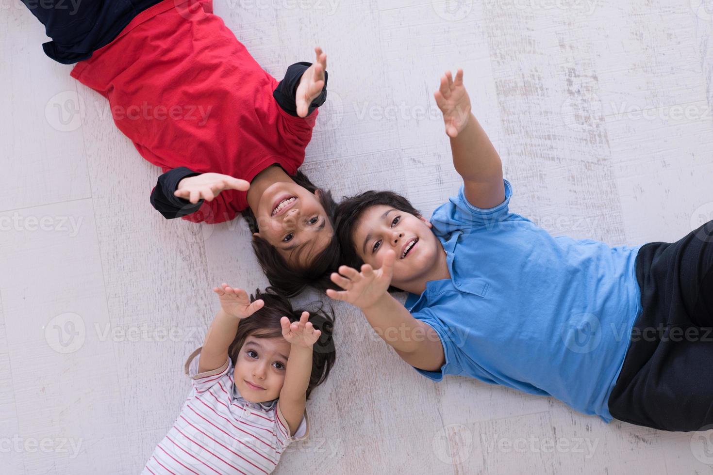 young boys having fun on the floor photo
