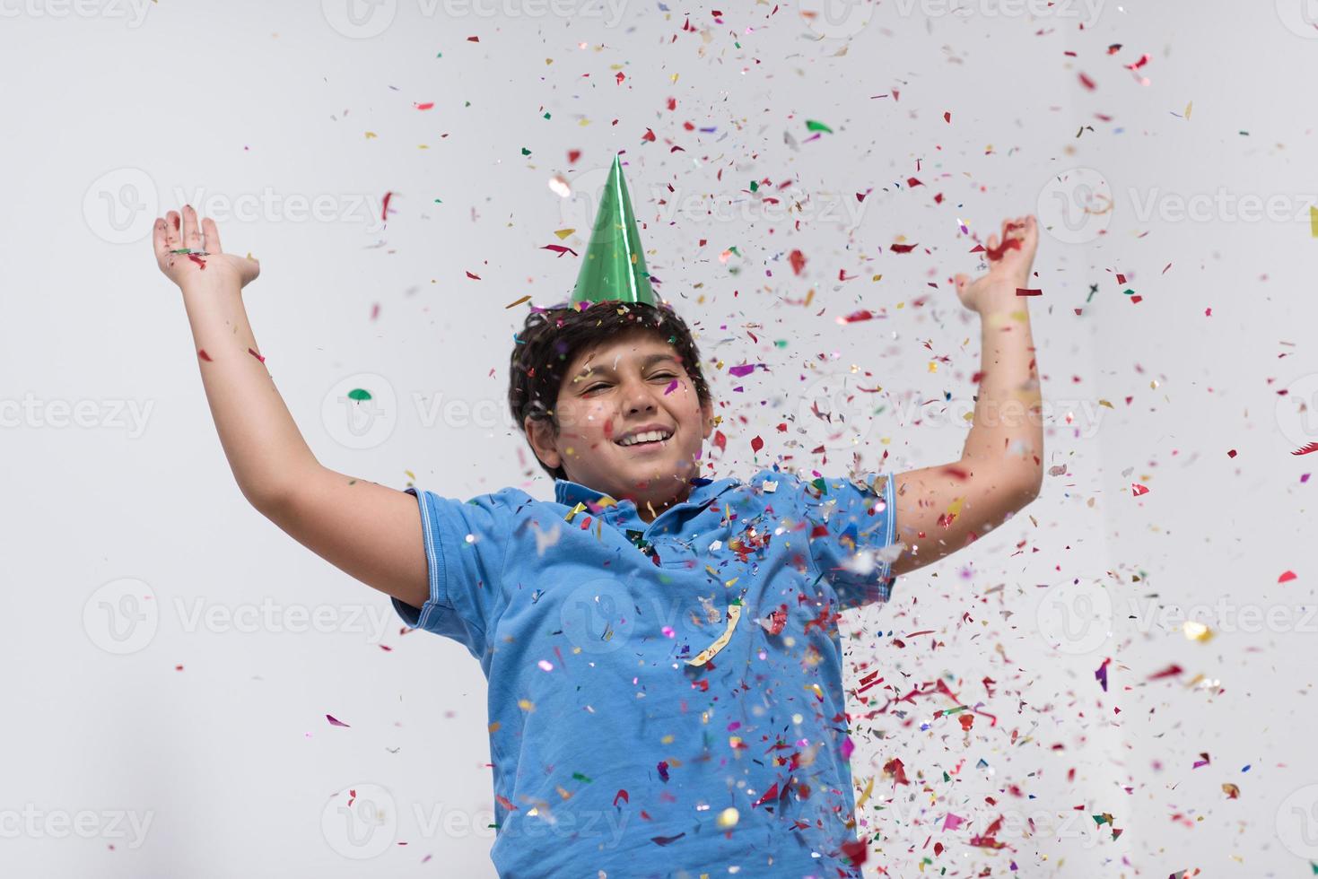 kid blowing confetti photo