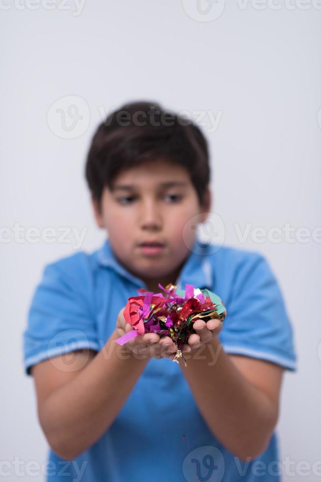 kid blowing confetti photo