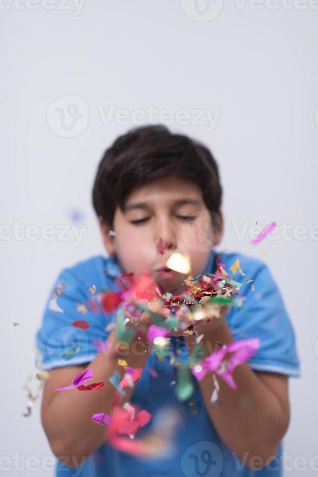 kid blowing confetti photo