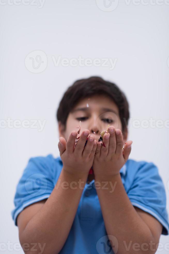 kid blowing confetti photo