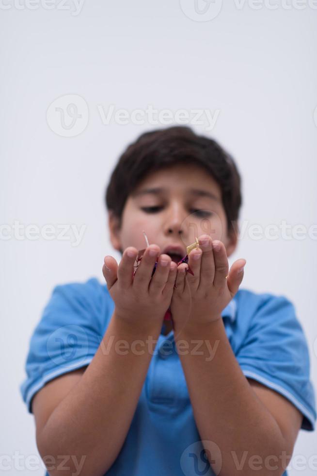 kid blowing confetti photo