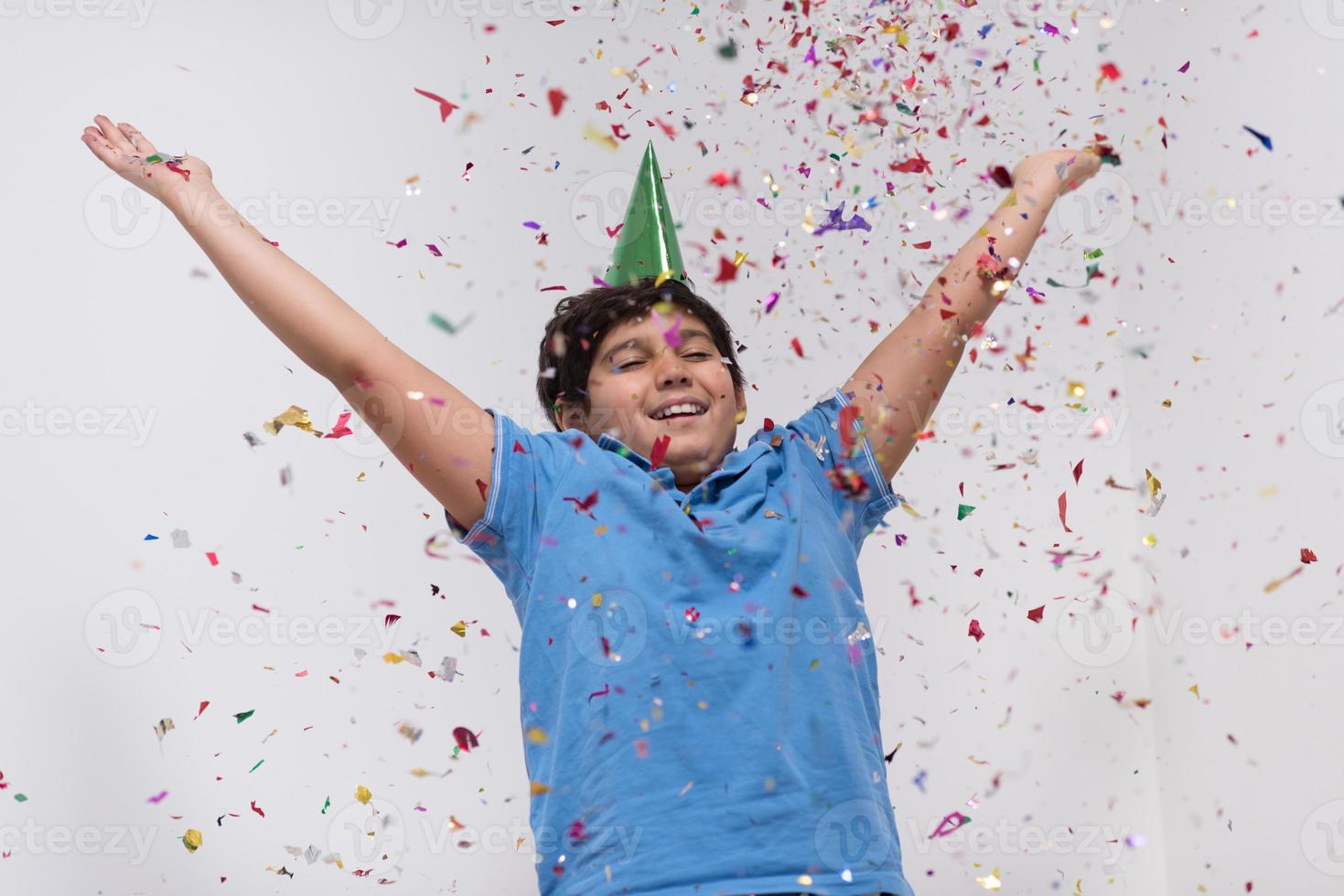 kid blowing confetti photo