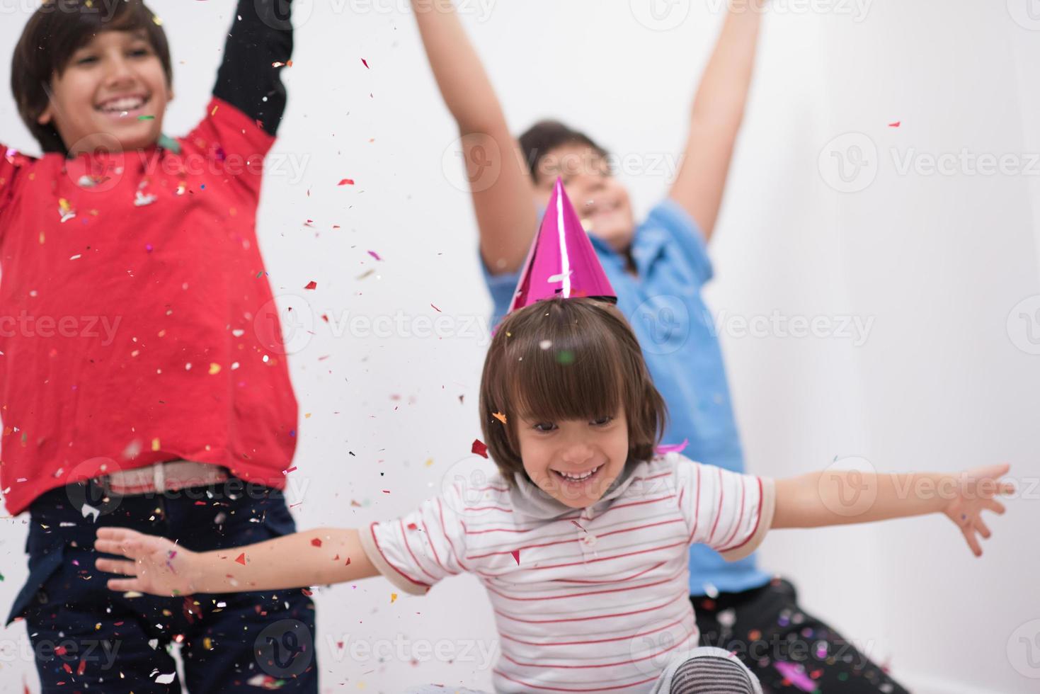 kids  blowing confetti photo