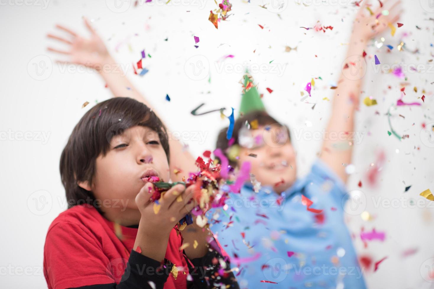 kids  blowing confetti photo