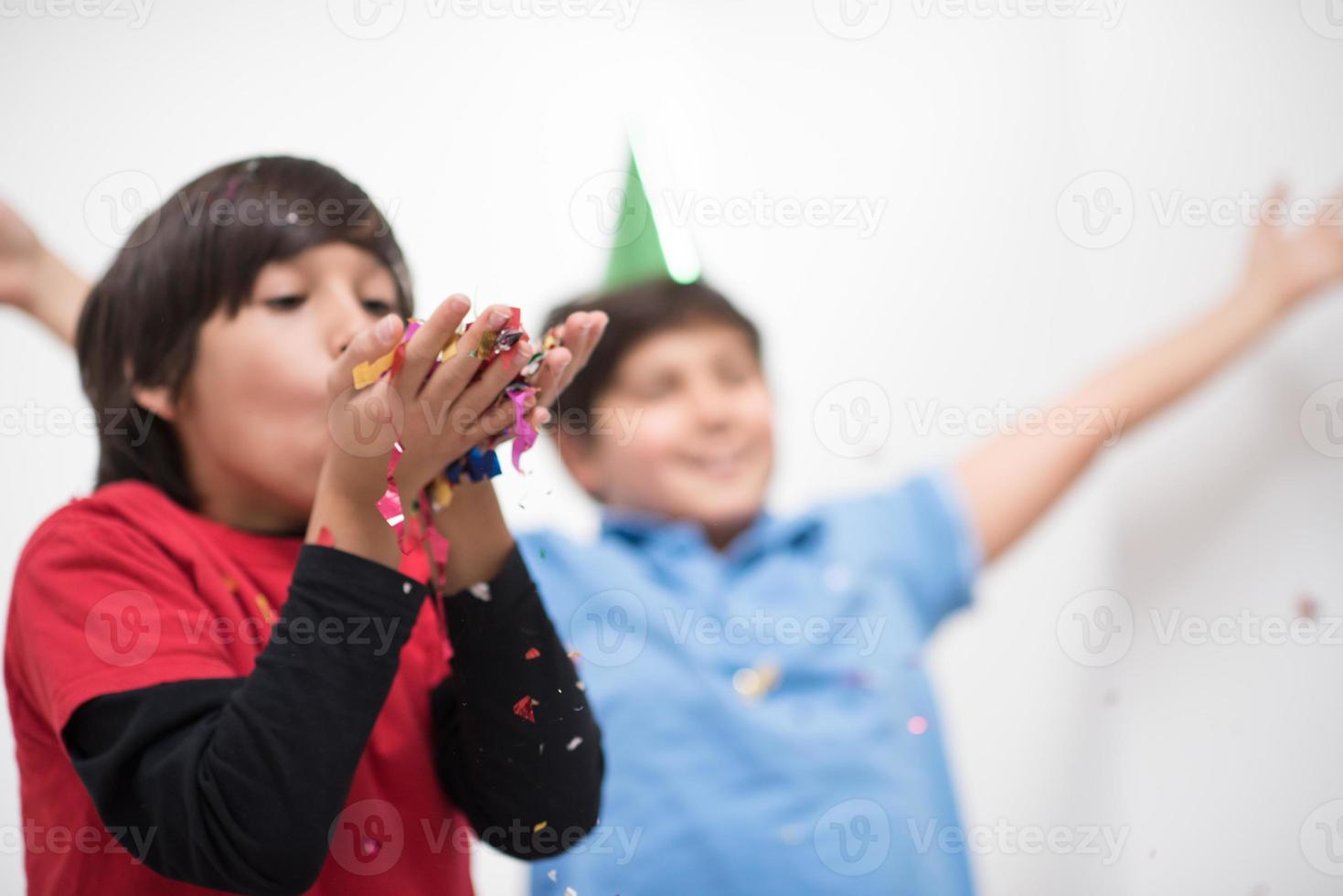 kids  blowing confetti photo