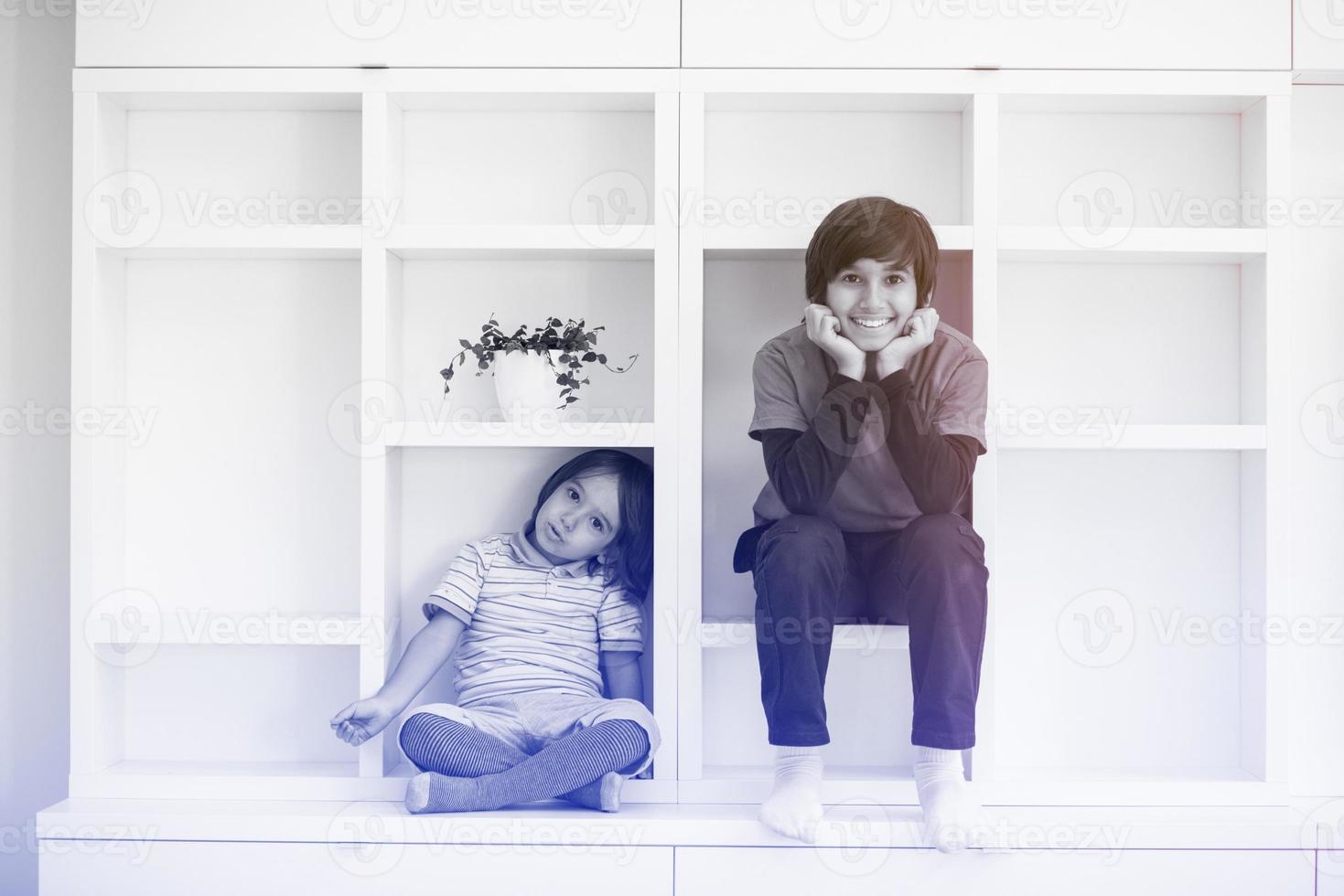 young boys posing on a shelf photo