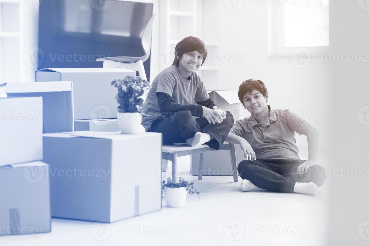 boys with cardboard boxes around them photo