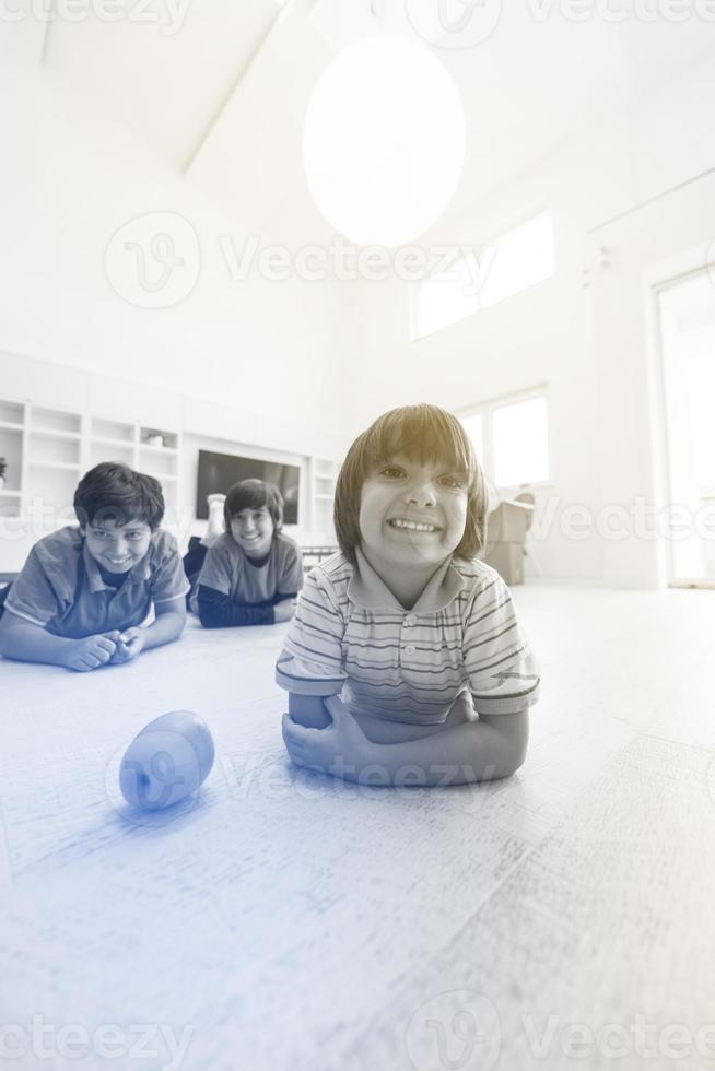 boys having fun with an apple on the floor photo