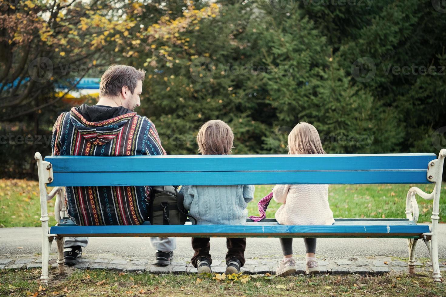 father and  child having fun together  in park photo