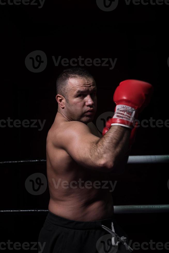 professional kickboxer in the training ring photo