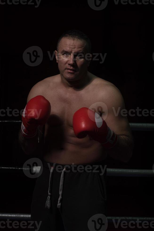 professional kickboxer in the training ring photo