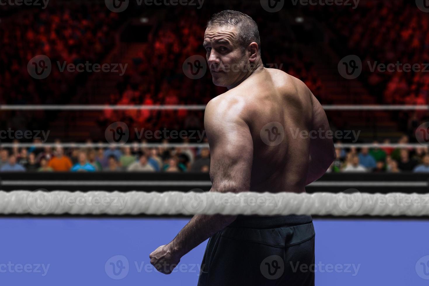 professional kickboxer in the training ring photo