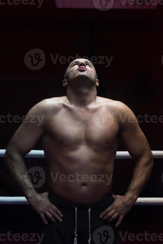 portrait of muscular professional kickboxer photo