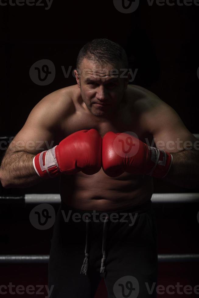 professional kickboxer in the training ring photo