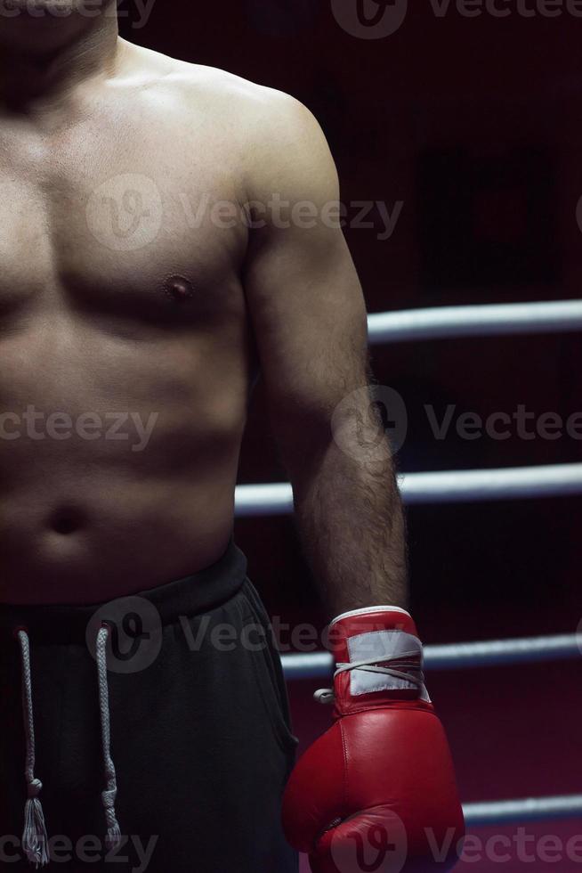 kick boxer with a focus on his glove photo