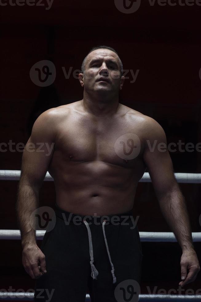 portrait of muscular professional kickboxer photo