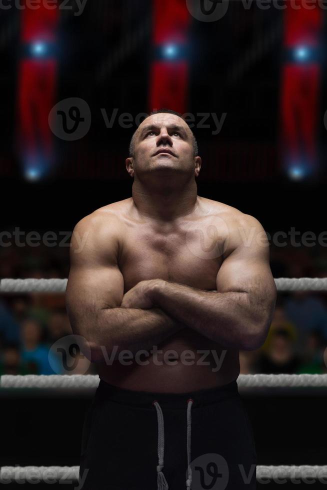 professional kickboxer in the training ring photo