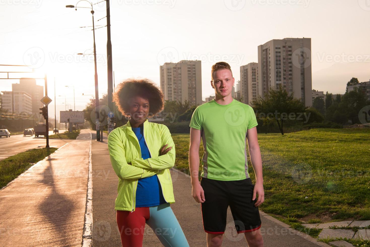 Portrait of romantic pretty couple on fitness session, outside town background photo