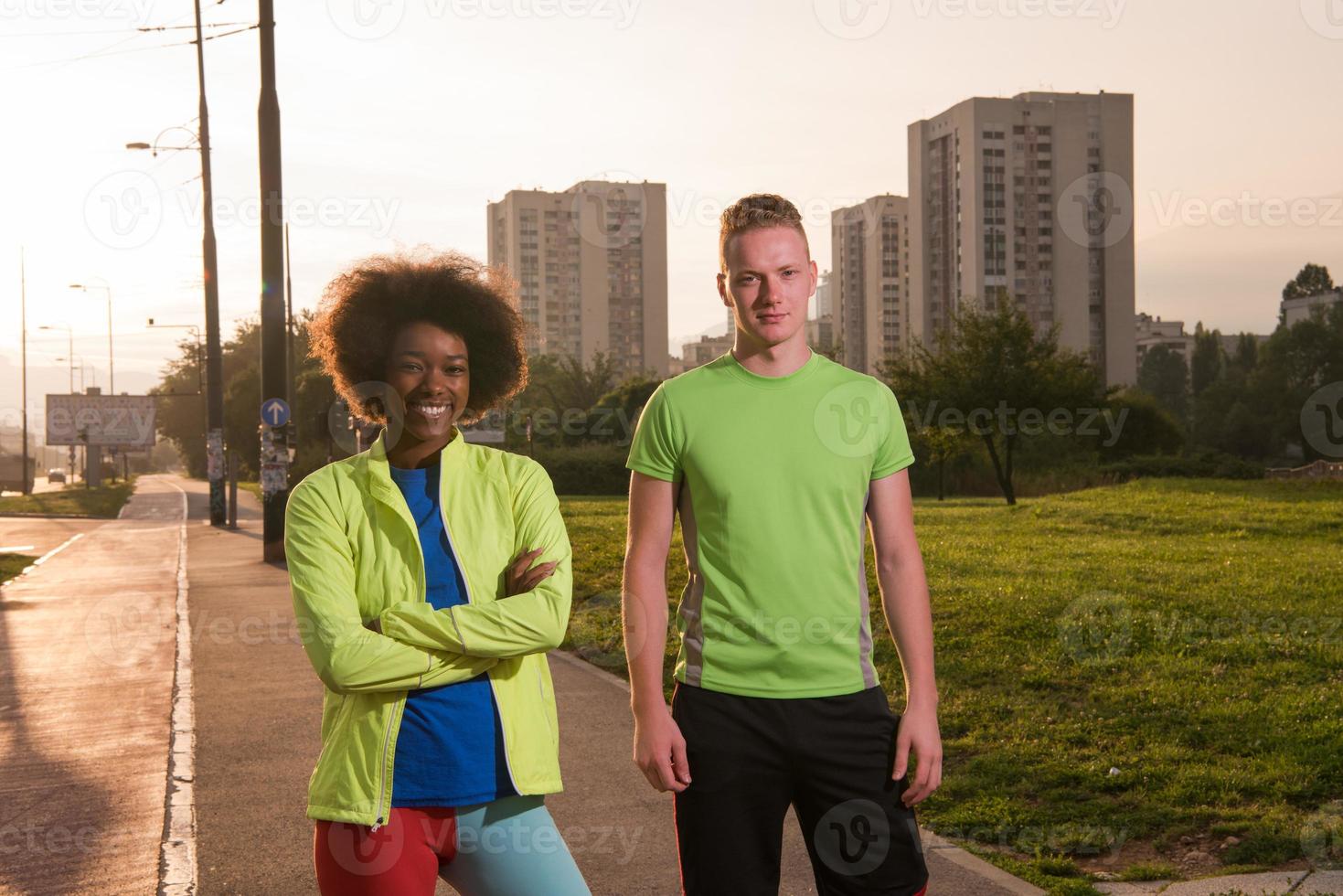 Portrait of romantic pretty couple on fitness session, outside town background photo