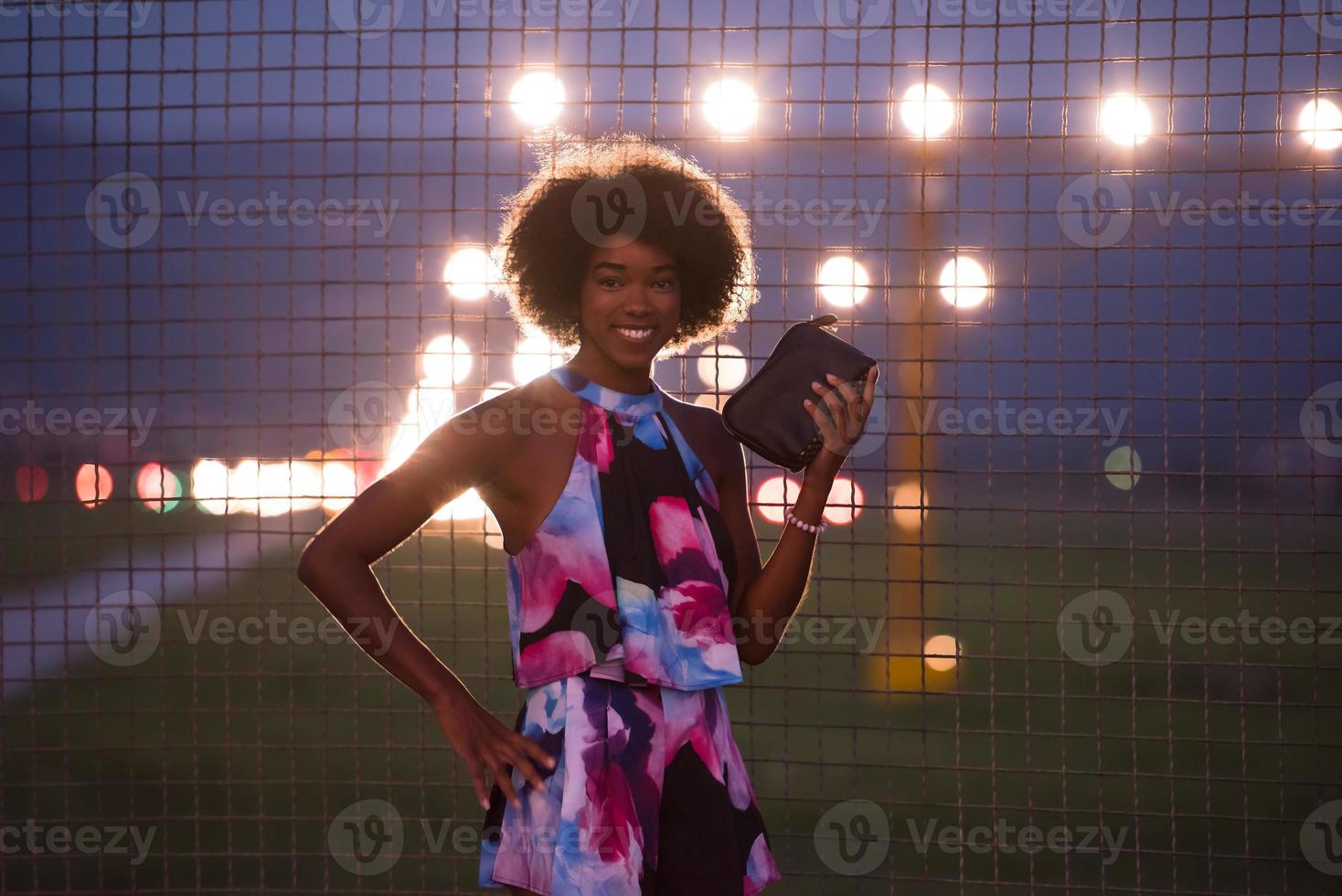 portrait of a young African-American woman in a summer dress photo