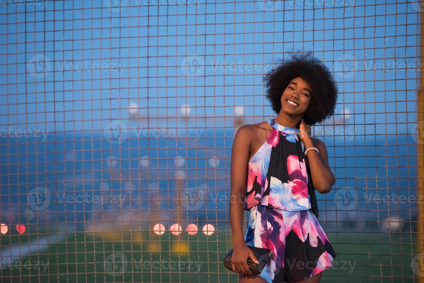 portrait of a young African-American woman in a summer dress photo