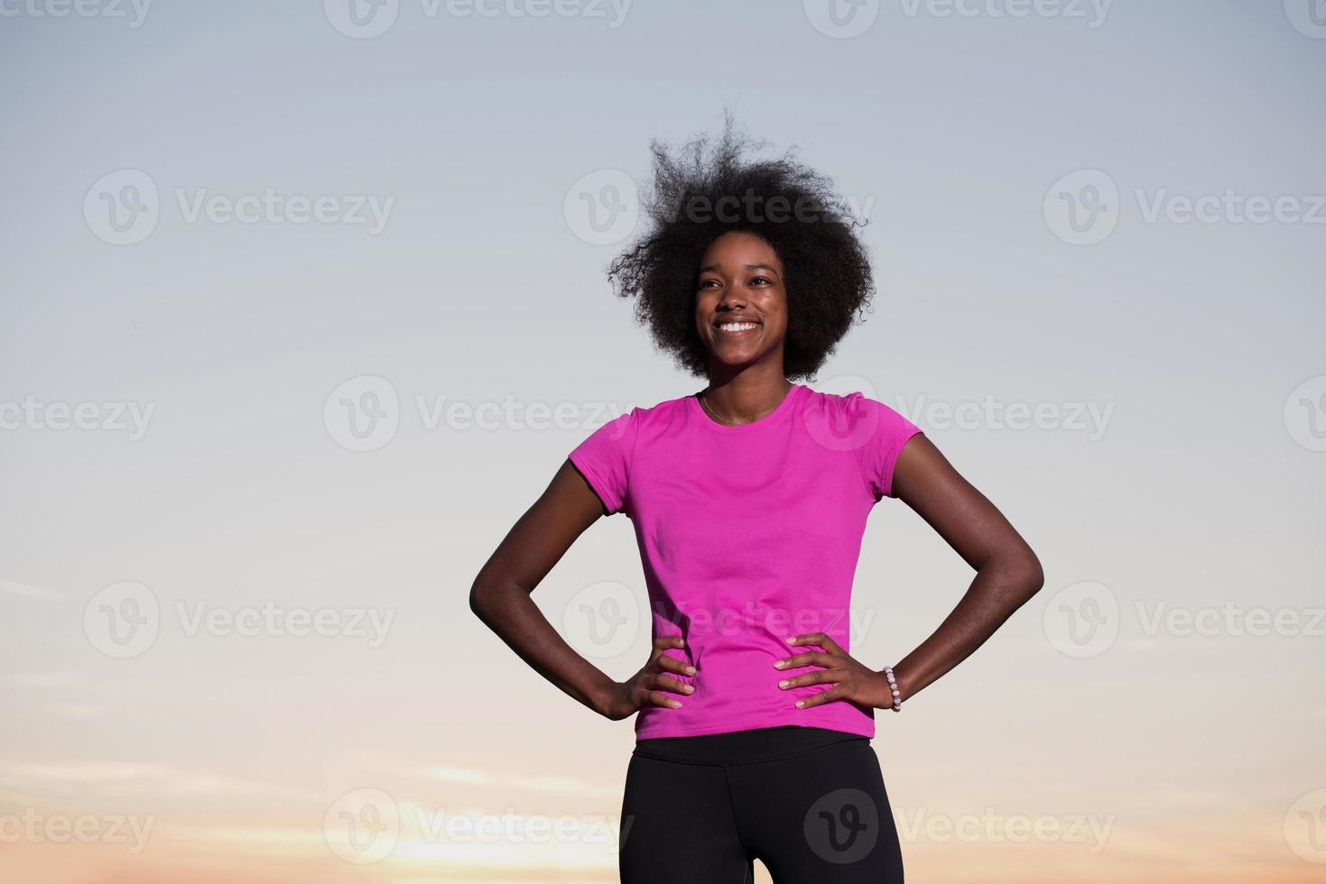 Portrait of a young african american woman running outdoors photo