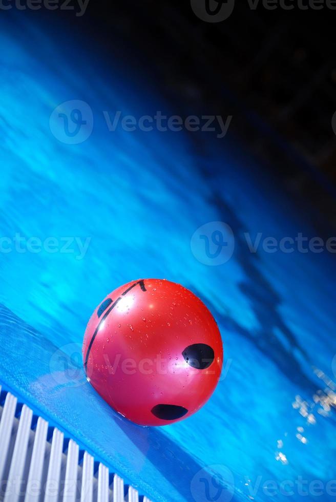 .red ball in swimming pool photo