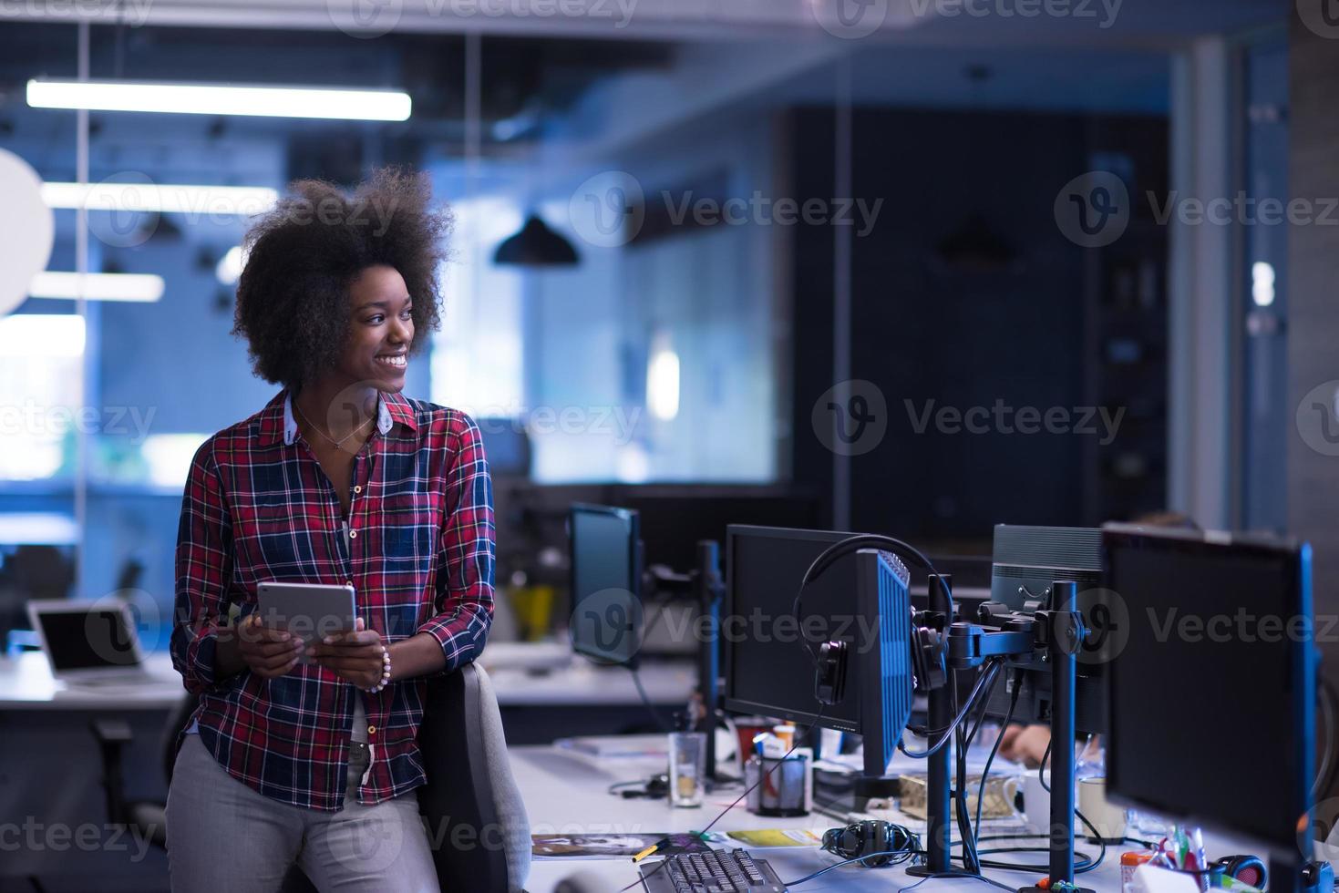 portrait of a young successful African-American woman in modern office photo