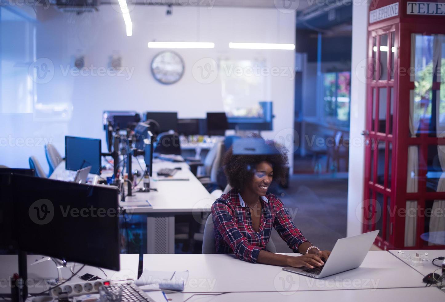 portrait of a young successful African-American woman in modern office photo