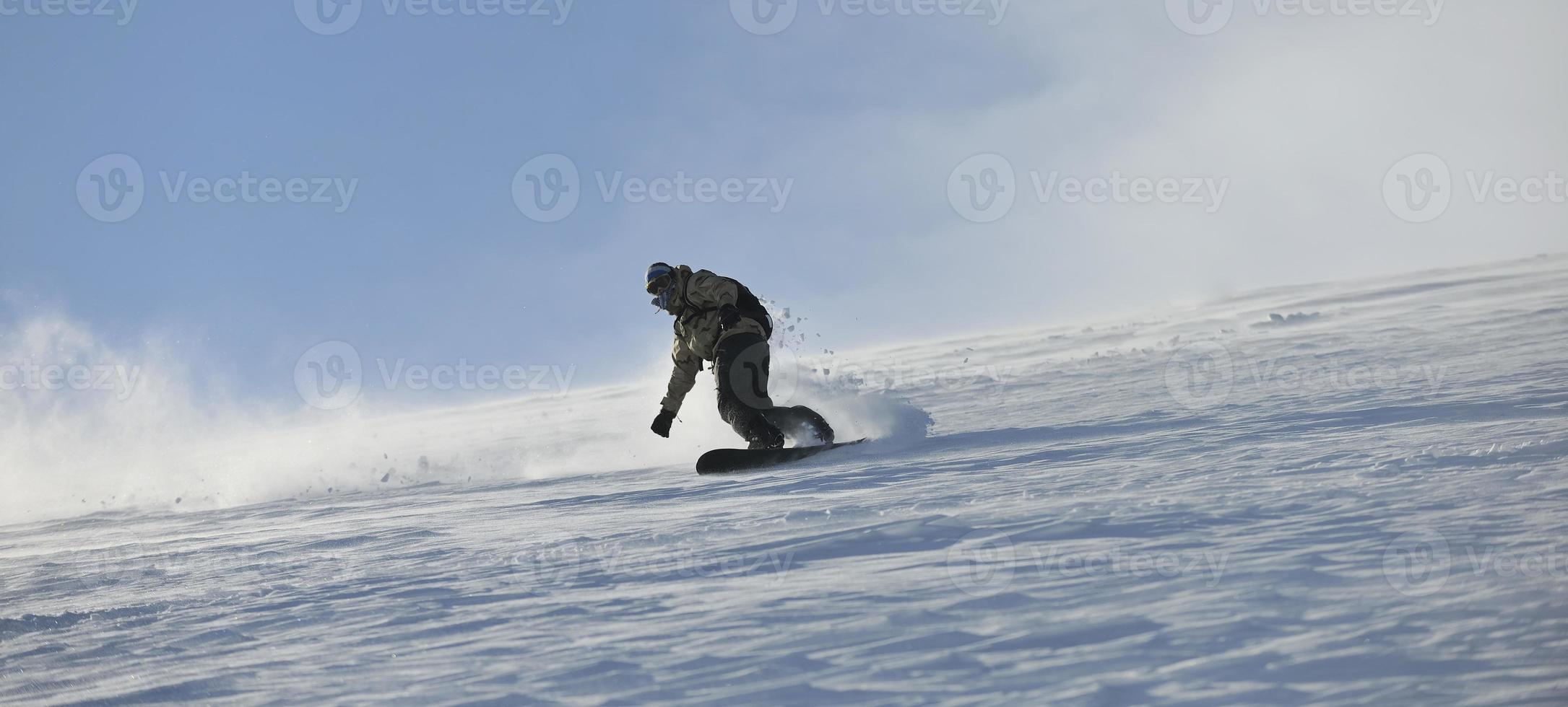 freestyle snowboarder jump and ride photo