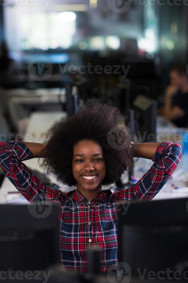 portrait of a young successful African-American woman in modern office photo