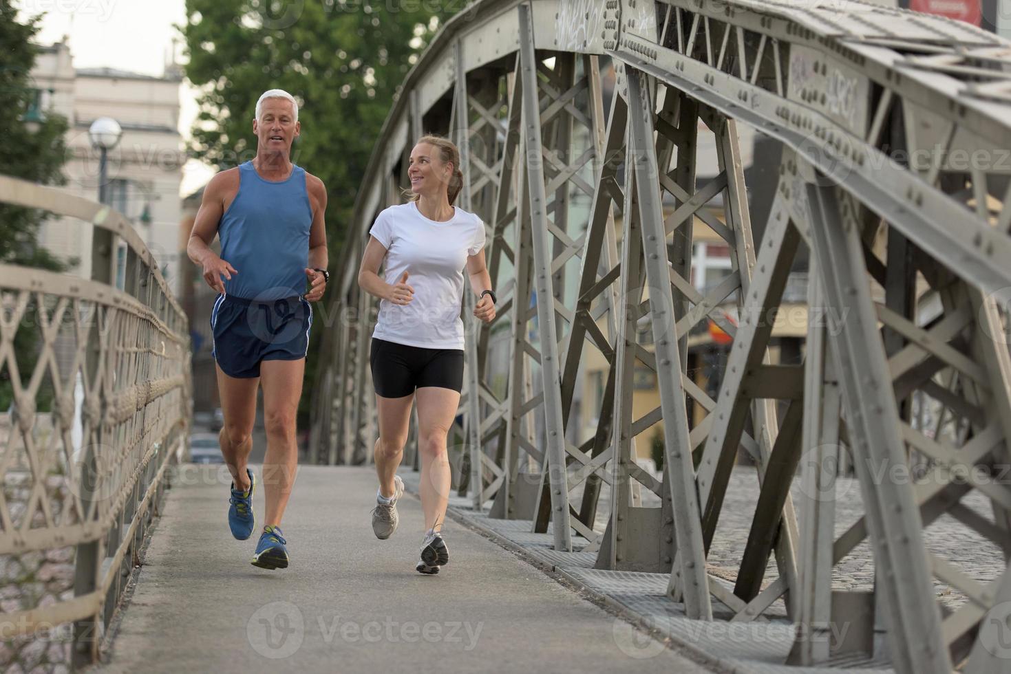 Couple jogging outside photo