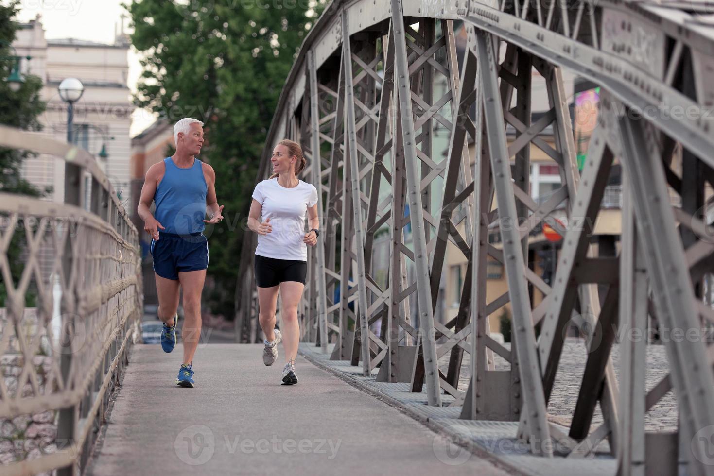 Couple jogging outside photo