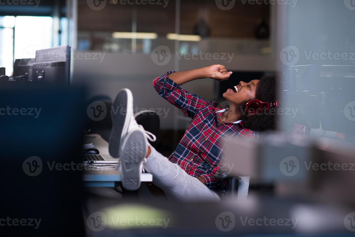 portrait of a young successful African-American woman in modern office photo