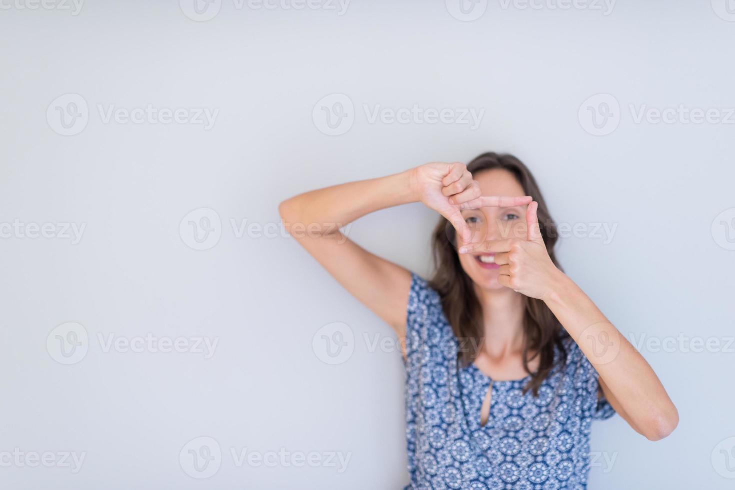 woman showing framing hand gesture photo